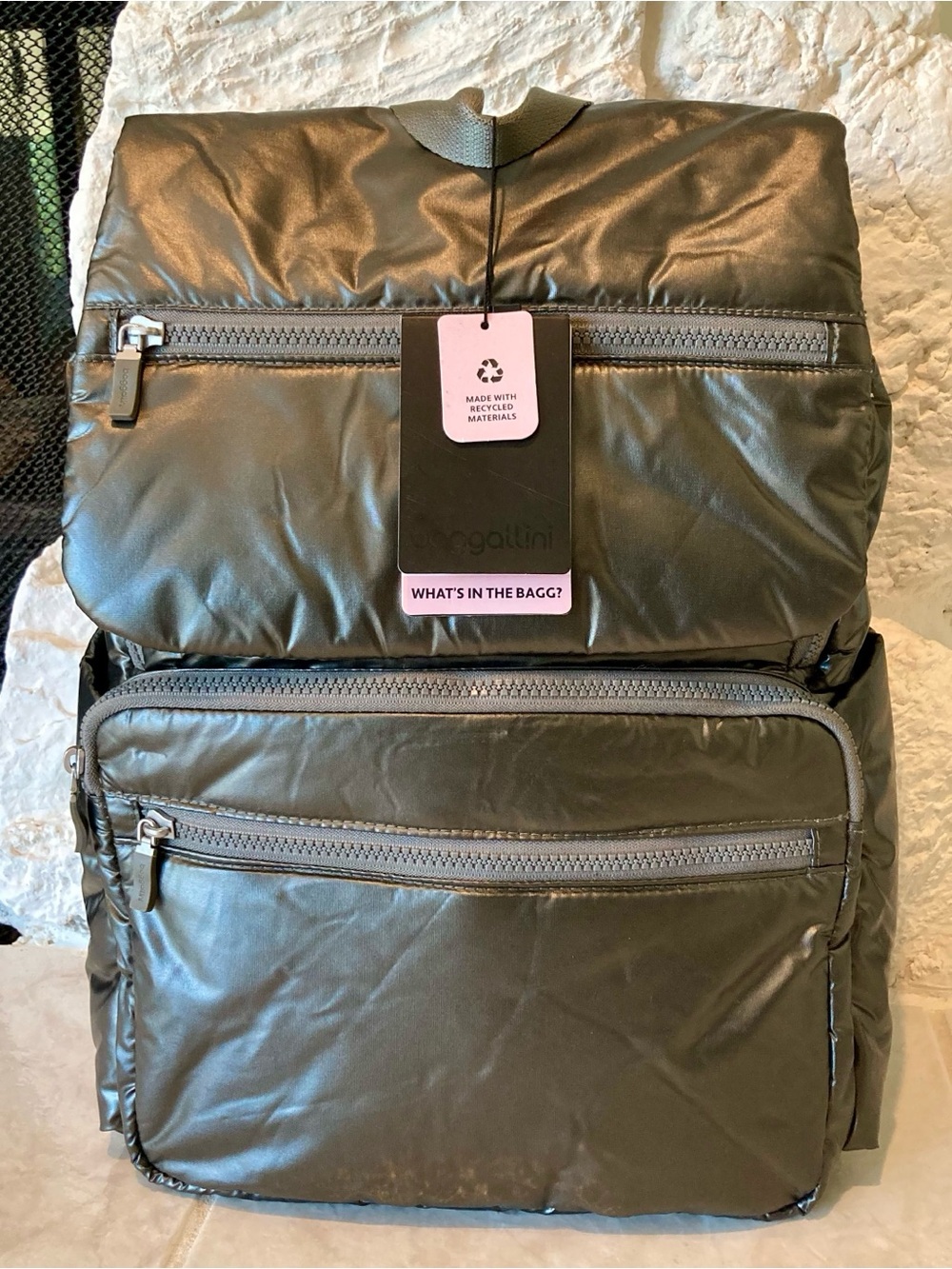 NWT Baggalini “Go to Laptop flap backpack” in a “gunmetal puff” finish
